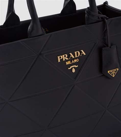 prada symbole bag price|prada logo plaque tote.